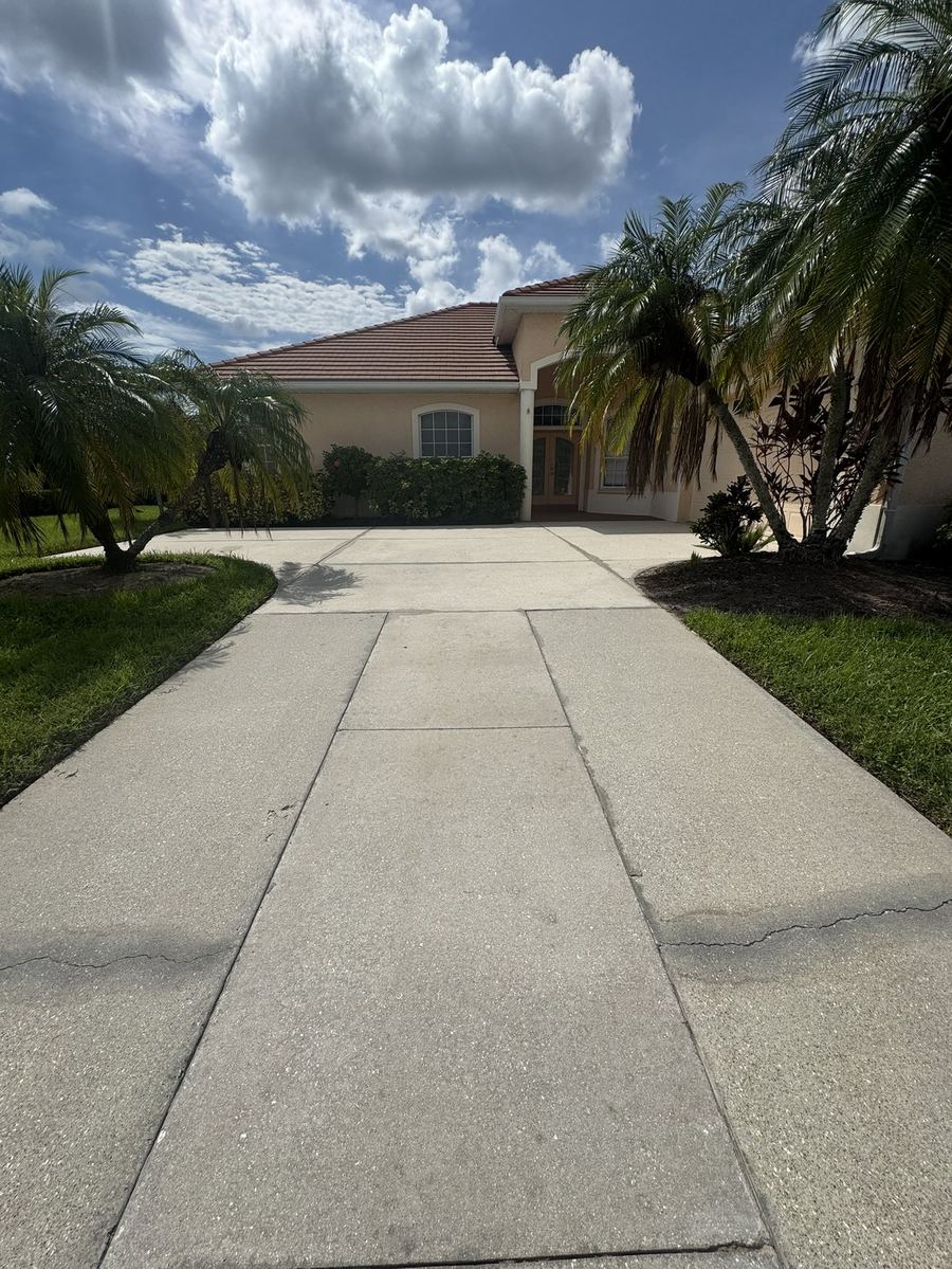 The same home and driveway after pressure washing